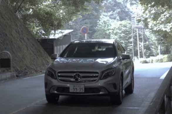 An image of a vehicle driving through a tunnel on an ordinary road at low speed