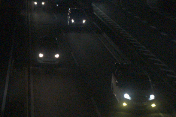 An image of vehicles driving at night, captured using a camera without STARVIS 2 technology